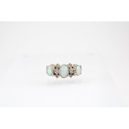 60 - A 9ct gold opal and diamond dress ring. Size P1/2. Weight 2.72 grams