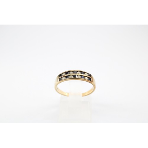 66 - A sapphire and diamond two row ring. Stamped 375. Size N 1/2. Weight 1.98 grams