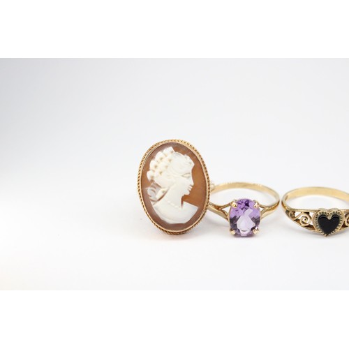 68 - Four rings with marks indicating 9ct gold. To include a cameo ring size L 1/2, an onyx heart ring si... 