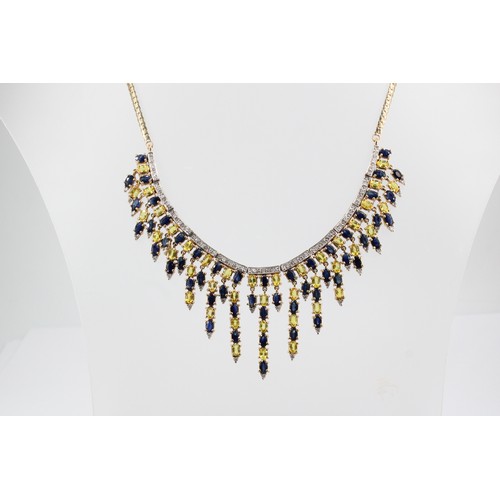 33 - A 9ct gold sapphire and diamond articulated graduated fringe centre piece necklace. Weight 41.49 gra... 