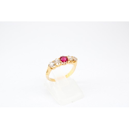 17 - An 18ct Ruby and Diamond Eternity ring, featuring a tapered detailed shoulder design. Approximately ... 