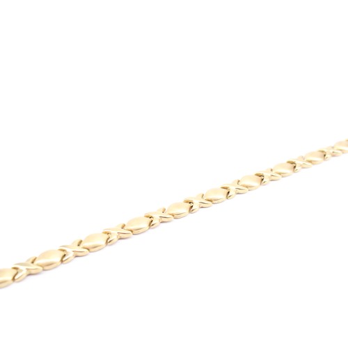 16 - A 14ct T&C Stamped 'Hugs and Kisses' Links Bracelet&nbsp;Weight: 5g Length: 18cm&nbsp;... 