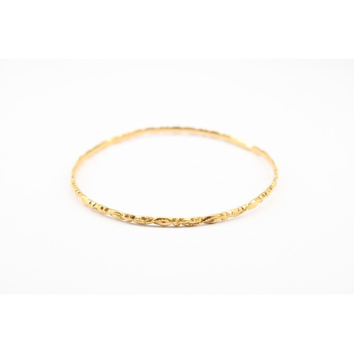 89 - A Yellow Metal High Gold Carat Tested Bangle, Believed to be 20/21ct with Twisted Diamond Cut Design... 