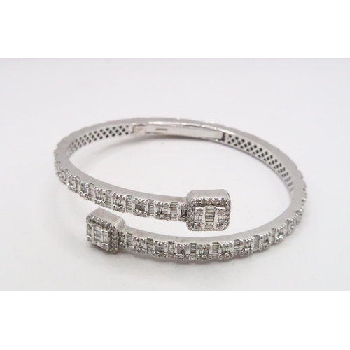 11 - A Stunning Designer White Gold Diamond Bangle Fully Hallmarked to the Inside, Approx. 6.25crts of Di... 