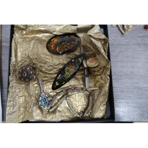 218 - An assortment of six pieces to include: two micro mosaic brooches and a panel bracelet; two floral b... 