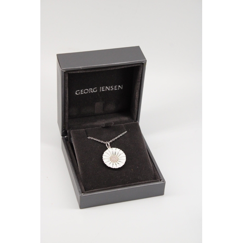10 - A Georg Jensen silver and enamel Daisy pendant on a silver chain - chain length 45cm with original b... 