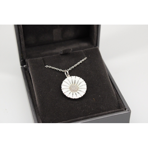 10 - A Georg Jensen silver and enamel Daisy pendant on a silver chain - chain length 45cm with original b... 