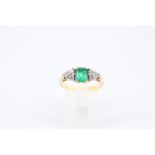 14 - An 18ct Emerald & Diamond Ring, Featuring a Central Radiant Cut Emerald with clusters of three d... 