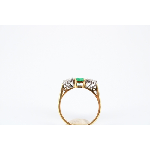 14 - An 18ct Emerald & Diamond Ring, Featuring a Central Radiant Cut Emerald with clusters of three d... 
