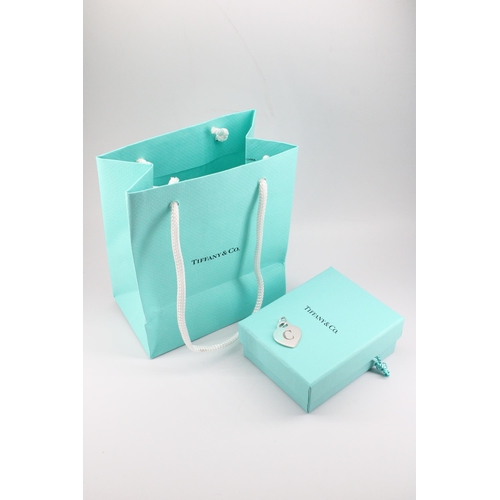 2 - A Tiffany & Co. sterling silver 'C' charm - approx weight 5.66g, approx width 2cm - with box, ba... 