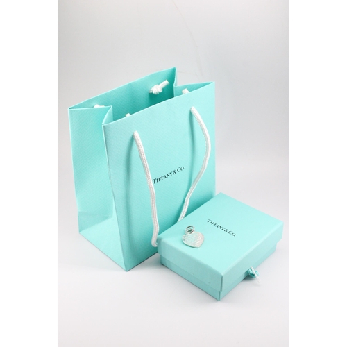 3 - A Tiffany & Co. sterling silver charm - approx weight 6.19g, approx width 2cm - with box, bag an... 