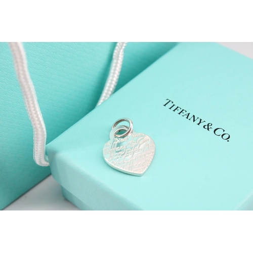 3 - A Tiffany & Co. sterling silver charm - approx weight 6.19g, approx width 2cm - with box, bag an... 
