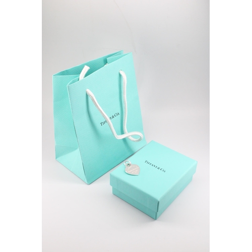 4 - A Tiffany & Co. sterling silver 'Please Return To Tiffany' charm - approx weight 5.94g, approx w... 