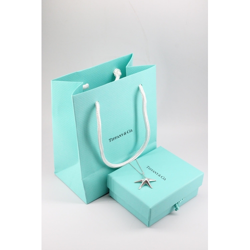 7 - A Tiffany & Co Elsa Peretti sterling silver starfish pendant and chain, with original box and ba... 