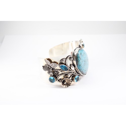 21 - An Unusual Large Silver Turquoise and Blue Stone Bangle with an Intricate Design of Butterflies and ... 
