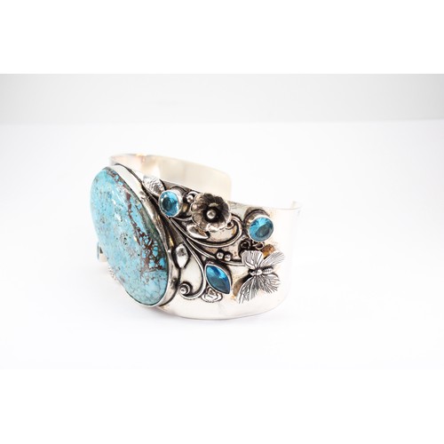 21 - An Unusual Large Silver Turquoise and Blue Stone Bangle with an Intricate Design of Butterflies and ... 