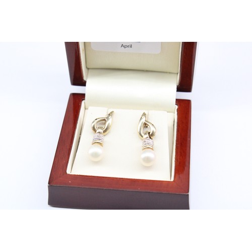 22 - A&nbsp;9ct Yellow Gold Pearl Drop Ear Rings with a Diamond Collar, Length approx.&nbsp;25mm, Pearls ... 