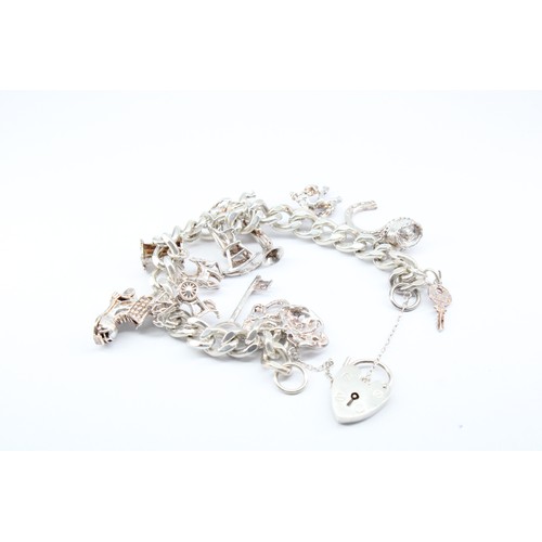 29 - A&nbsp;Silver Charm Bracelet in Very Good Condition, Weight approx. 54grms