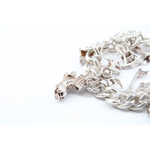 29 - A&nbsp;Silver Charm Bracelet in Very Good Condition, Weight approx. 54grms