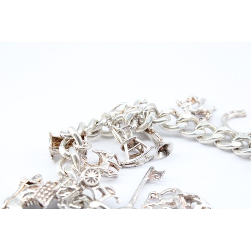 29 - A&nbsp;Silver Charm Bracelet in Very Good Condition, Weight approx. 54grms