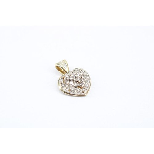 171 - A 9ct Heart Pendant Set with Small with Small White Stones Believed to be diamonds. 1.9cm x 1.3cm&nb... 