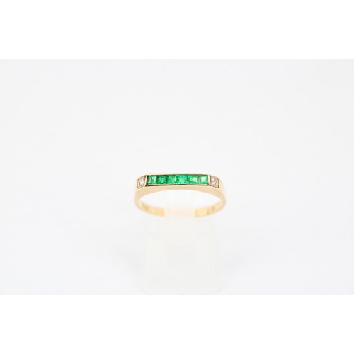 7 - An 18ct Emerald & Diamond Chanel Set Eternity Ring Weight: 2.13g Size: O