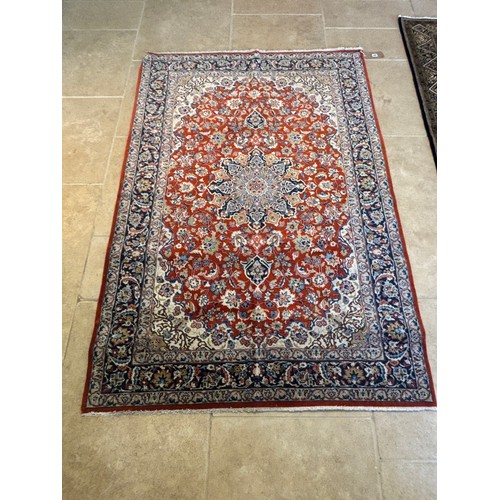 585 - A hand knotted woollen fine Isphahan rug - 2.05m x 1.40m