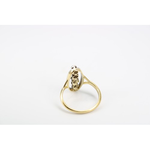 10 - An 18ct Edwardian Style Sapphire and Diamond Ring, Featuring a central oval head with pierced split ... 