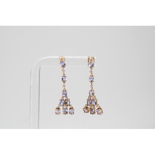 38 - A pair of tanzanite and diamond ear pendants. Length 33mm. Stamped 10K. Weight 2.79 grams