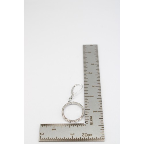 39 - A pair of diamond circle ear pendants. Length 40mm. Stamped 10K. Weight 3.11 grams