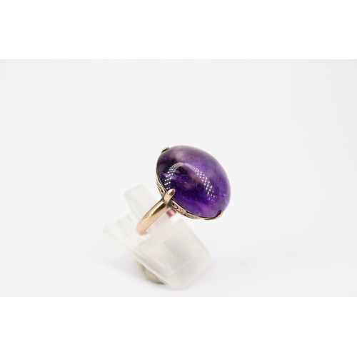 21 - A 14ct Cabochon Cut Amethyst Ring&nbsp;Weight: 6.42g Size: J