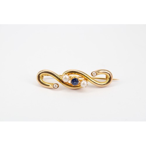 24 - An Unmarked 18ct Tested S-Shape Brooch with Central Sapphire Flanked By Two Button Half Pearls&nbsp;... 