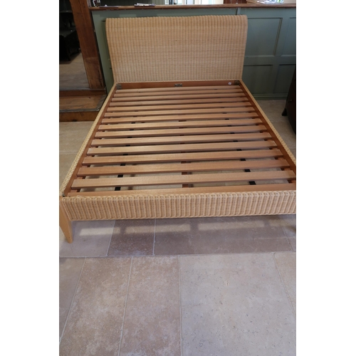 623 - A good quality wicker king size bed with hardwood slats - complete - no mattress