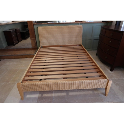 623 - A good quality wicker king size bed with hardwood slats - complete - no mattress