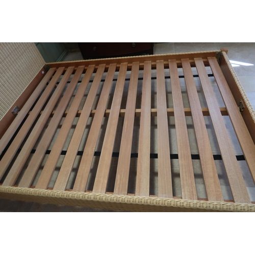 623 - A good quality wicker king size bed with hardwood slats - complete - no mattress