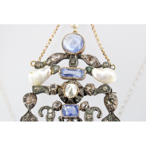 31 - An abstract openwork brooch pendant set with sapphire, diamond and freshwater cultured pearl. Length... 