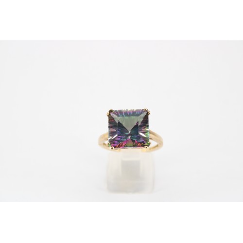 42 - A mystery synthetic sapphire single stone ring. Size P. Stamped 10K. Weight 4.13 grams
