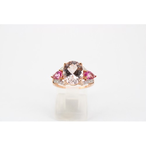 45 - A morganite, diamond and synthetic ruby dress ring. Size N 1/2. Stamped 10K. Weight 3.33 grams