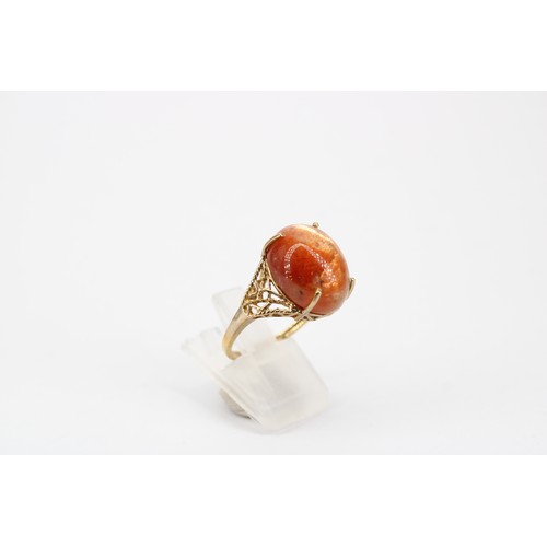 50 - A cosmic cabochon single stone ring. Stamped 10K. Size N 1/2. Weight 4.97 grams