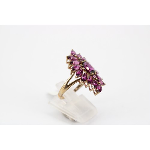 51 - A marquise shape rhodalite garnet cluster ring. Stamped 10K. Size O. Weight 4.85 grams