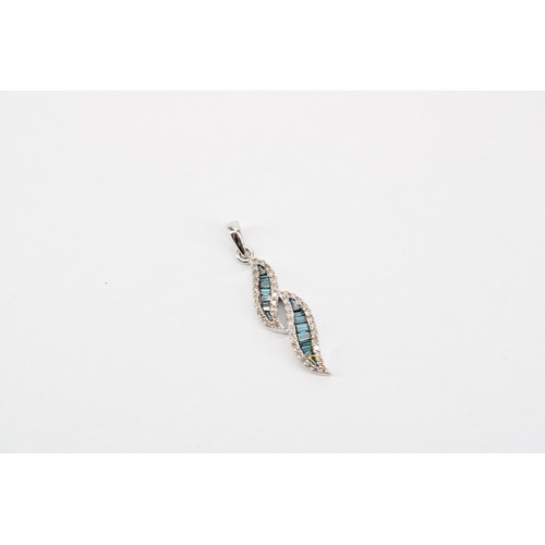 58 - An irradiated blue diamond and diamond pendant. Length 31mm. Stamped 10K. Weight 1.82 grams