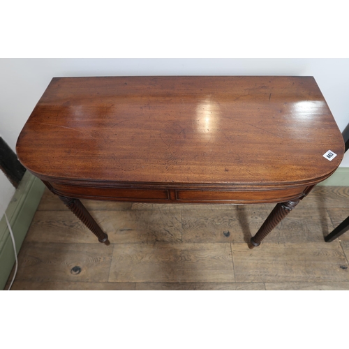 663 - A good quality Regency mahogany fold over tea table with four twisted legs, with a very good patina ... 