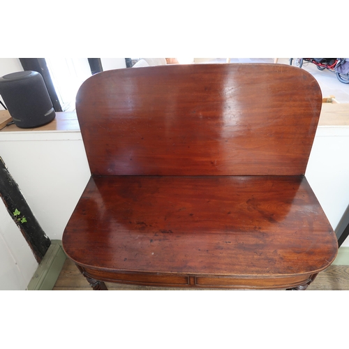 663 - A good quality Regency mahogany fold over tea table with four twisted legs, with a very good patina ... 