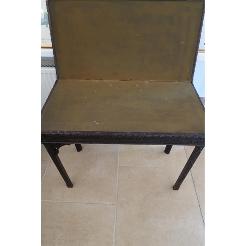  A Chinese Chippendale style mahogany fold over card table - needing some restoration