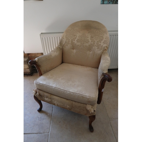  A 1950's walnut framed armchair