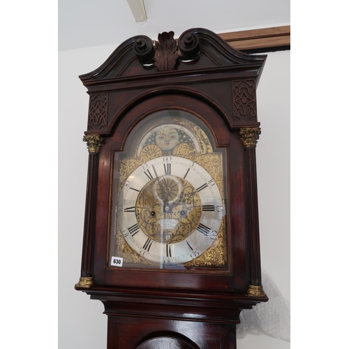  An 8 day mahogany grandfather clock with a brass face and moonroller dial with a plaque signed Geo M... 