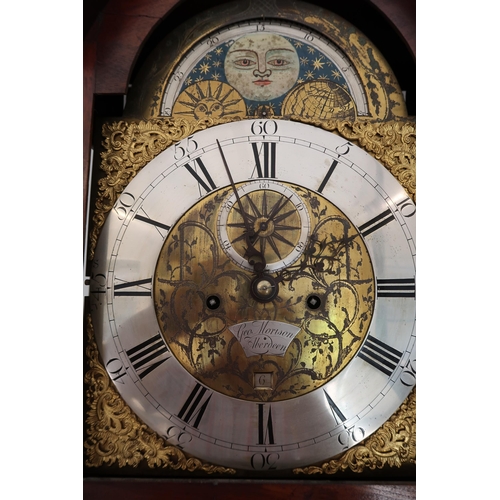  An 8 day mahogany grandfather clock with a brass face and moonroller dial with a plaque signed Geo M... 