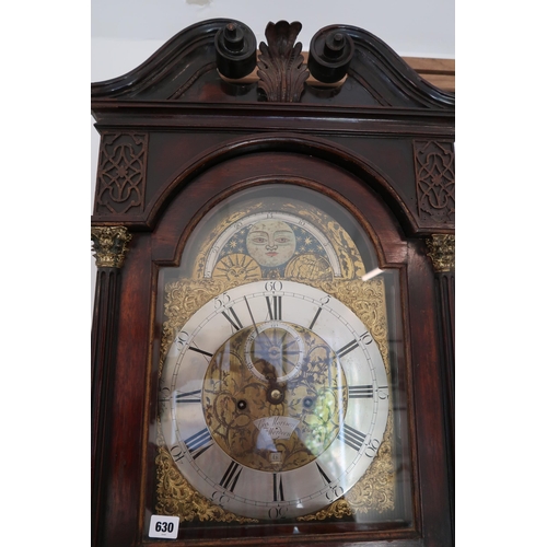 An 8 day mahogany grandfather clock with a brass face and moonroller dial with a plaque signed Geo M... 