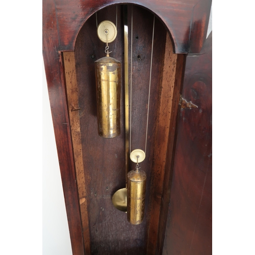  An 8 day mahogany grandfather clock with a brass face and moonroller dial with a plaque signed Geo M... 