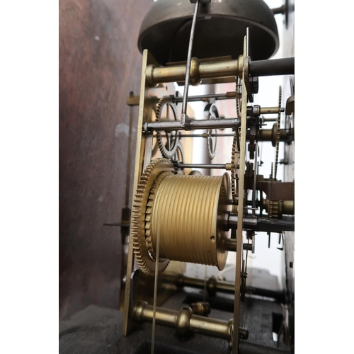  An 8 day mahogany grandfather clock with a brass face and moonroller dial with a plaque signed Geo M... 